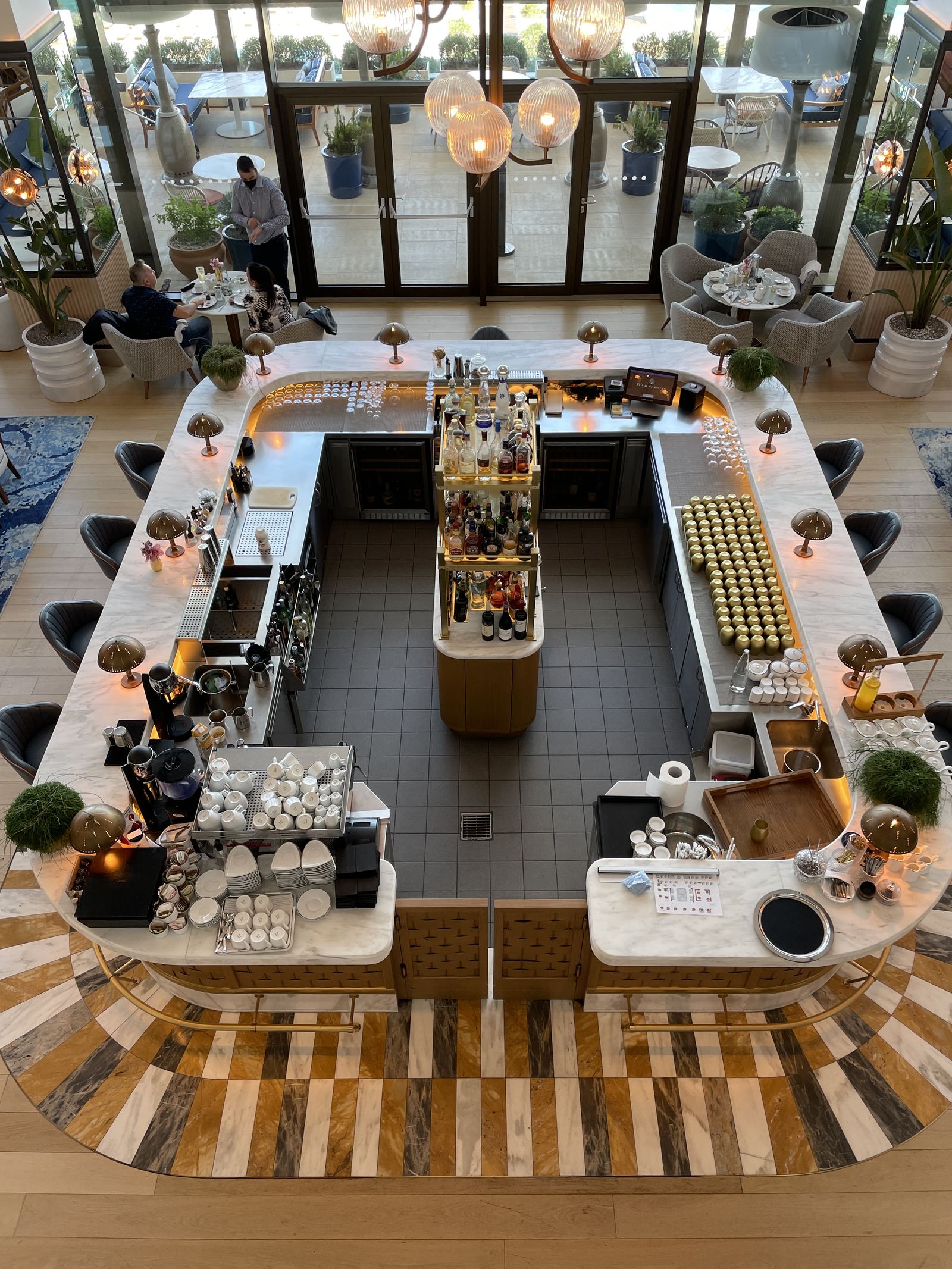 The Avra bar seen from above, the island counter and the sea beyond