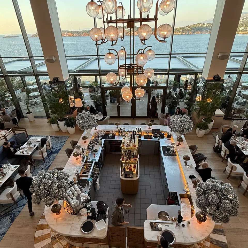 The Avra bar seen from the floor above, with the gulf beyond the glass