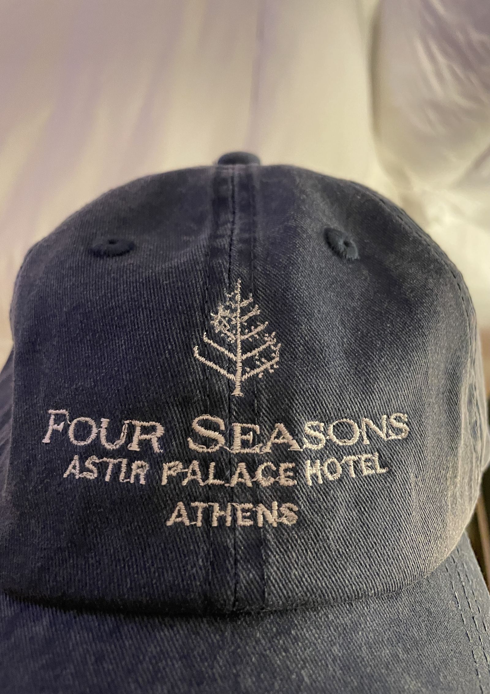 A navy cap embroidered Four Seasons Astir Palace Hotel Athens