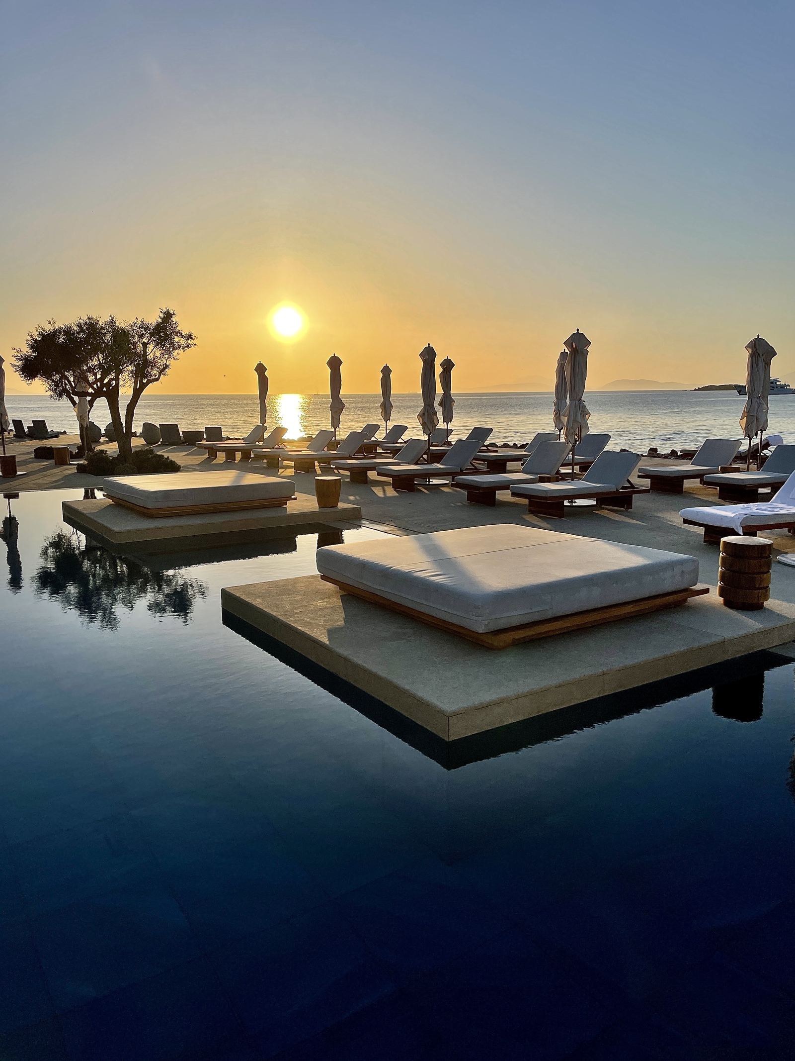 Floating daybeds on the water at sunset, Four Seasons Astir Palace, Athens
