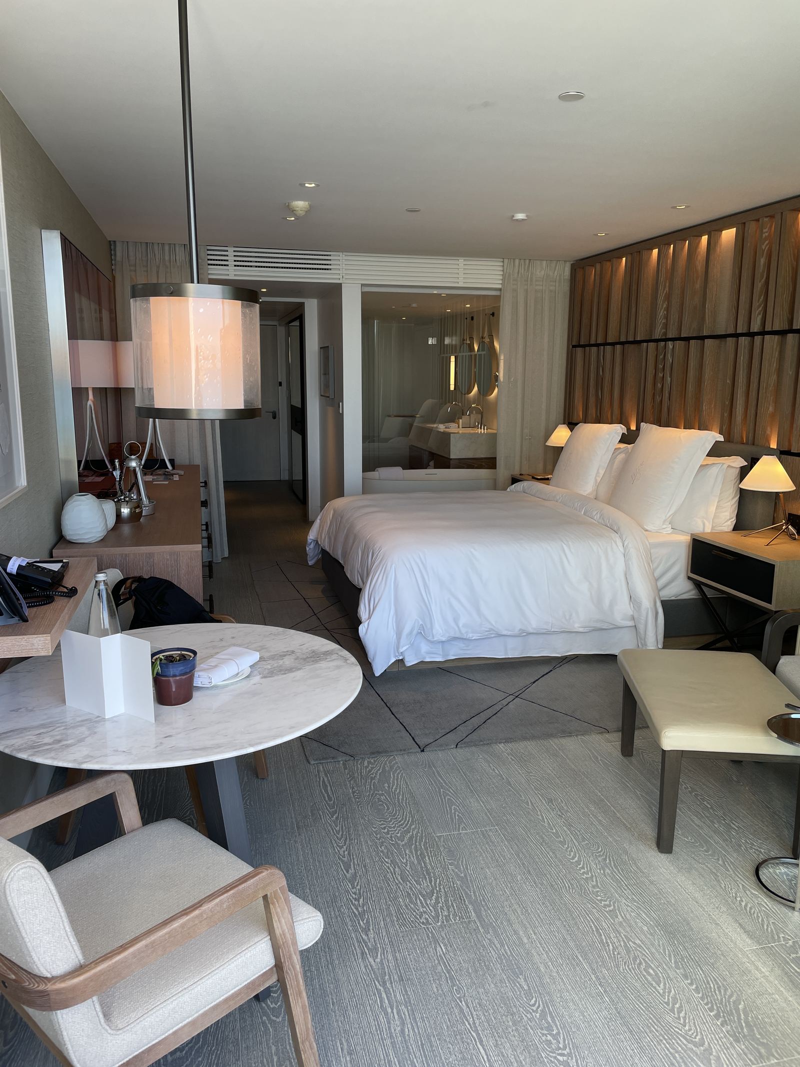 A Nafsika Sea-View Room in daylight with the bed and a table by the window