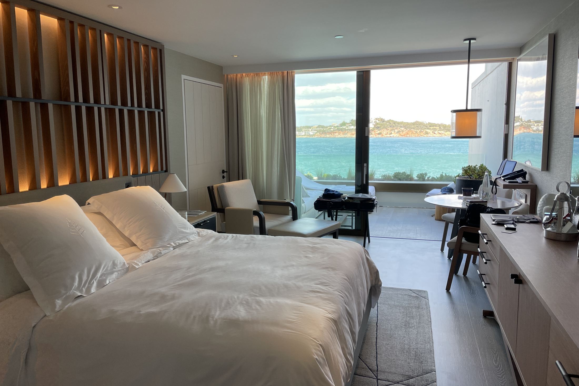 A Nafsika Sea-View Room with the glazing open onto the bay