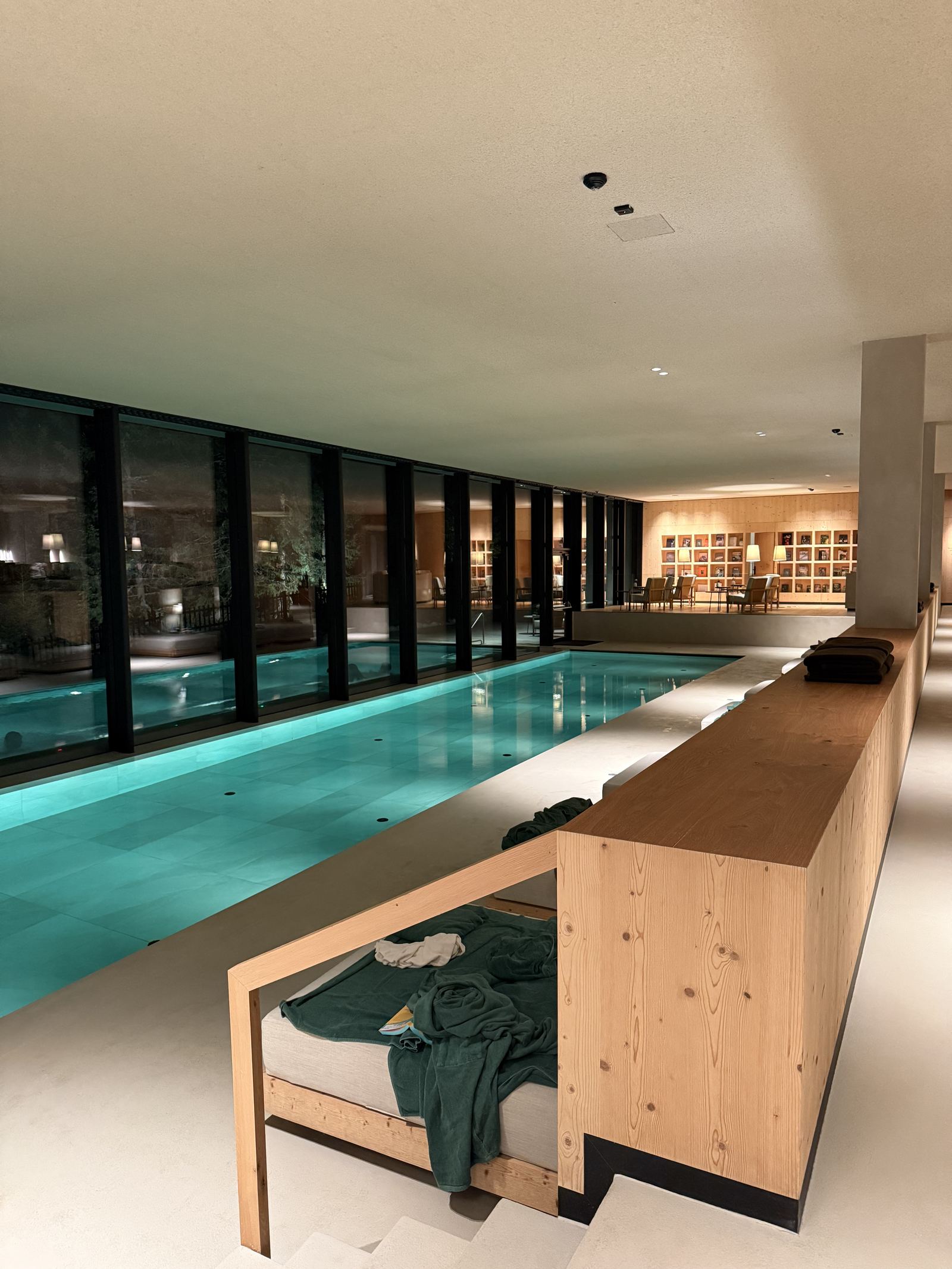 The indoor pool at FORESTIS lit at night