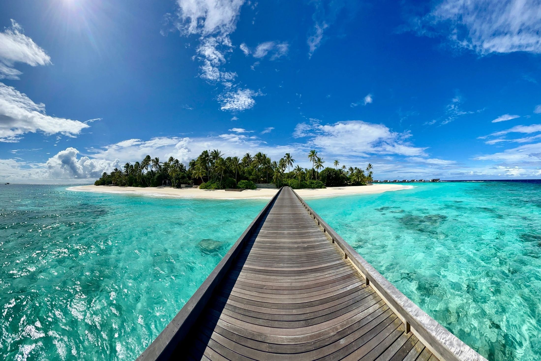The jetty running out to the island at Park Hyatt Maldives Hadahaa
