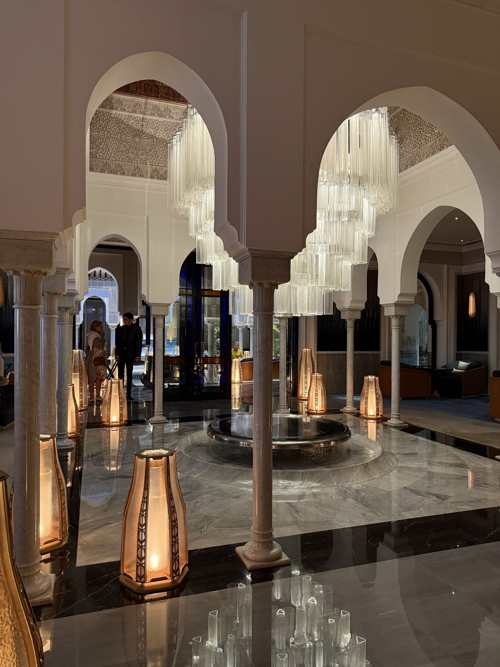 The Chandelier du Centenaire hanging over the entrance hall of La Mamounia, a long curtain of glass tubes lit from within