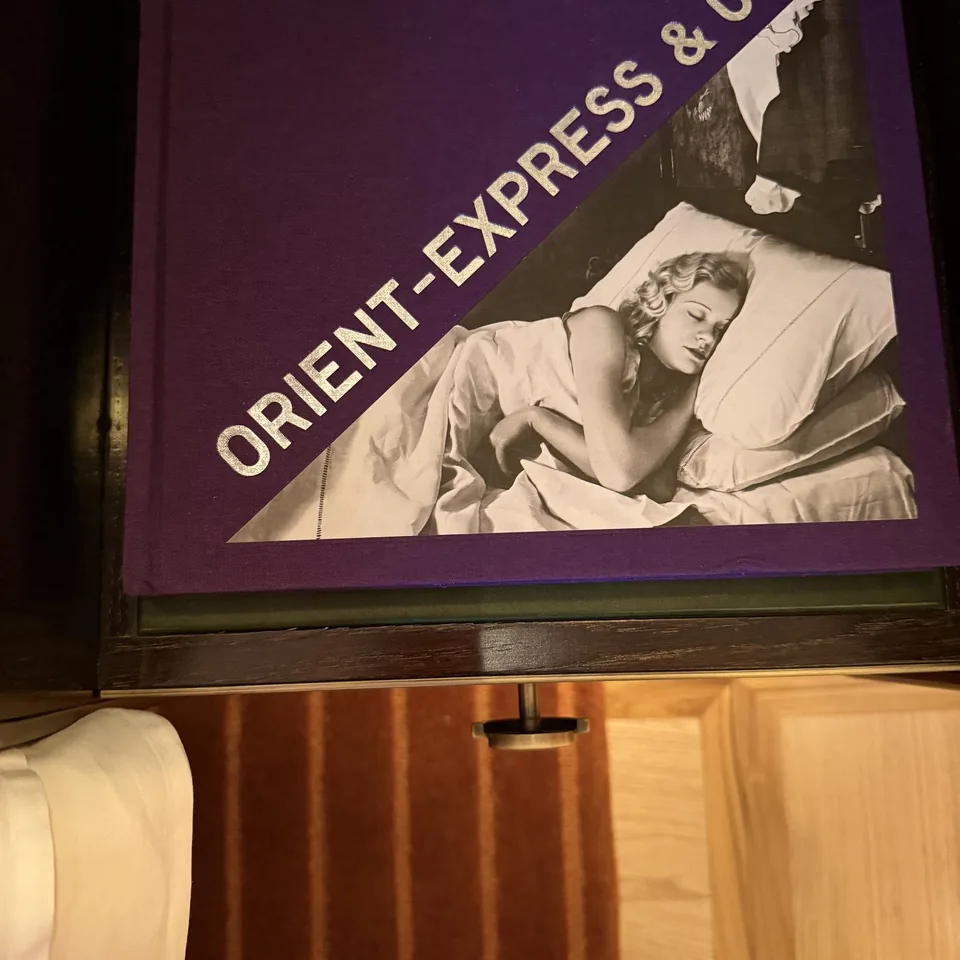 An Orient-Express & Co book lying on a timber surface