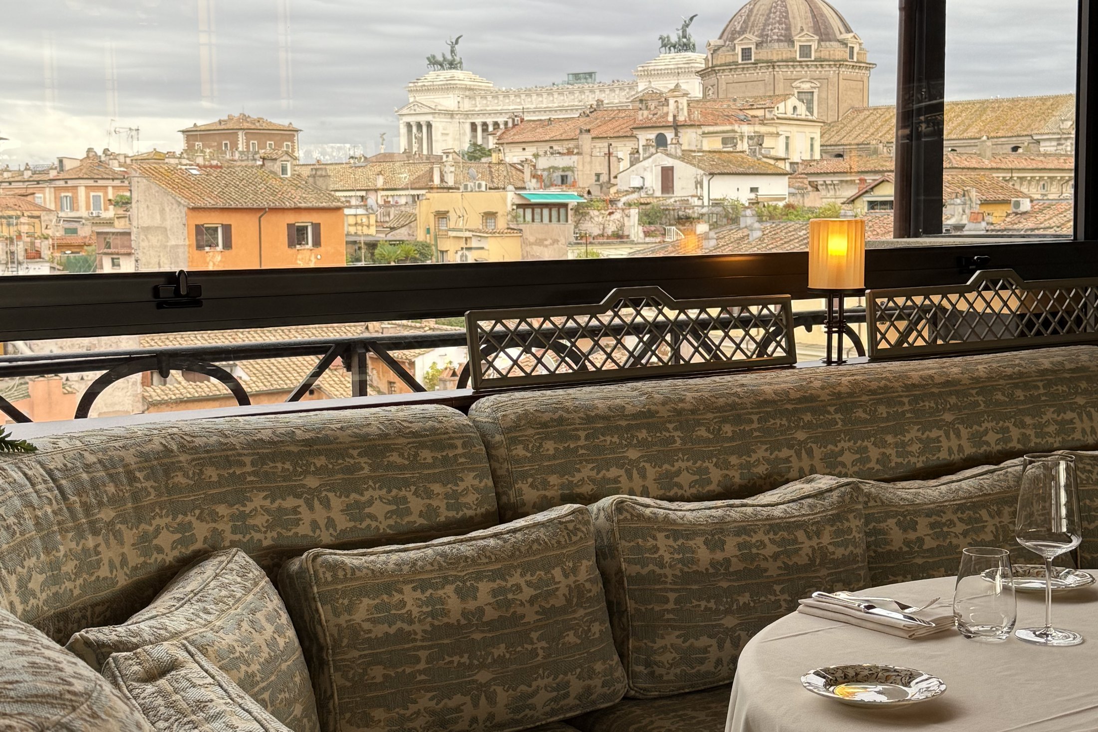 The rooftop terrace at La Minerva looking over the roofs of Rome to the Altare della Patria