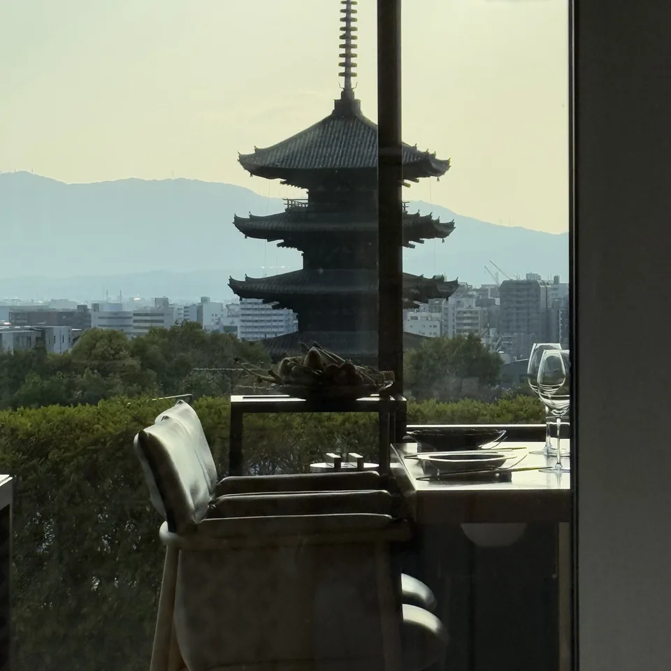 A chair at a window with the Yasaka pagoda framed beyond it